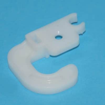 Hűtő ajtófordításhoz műanyag betét (bal oldali)